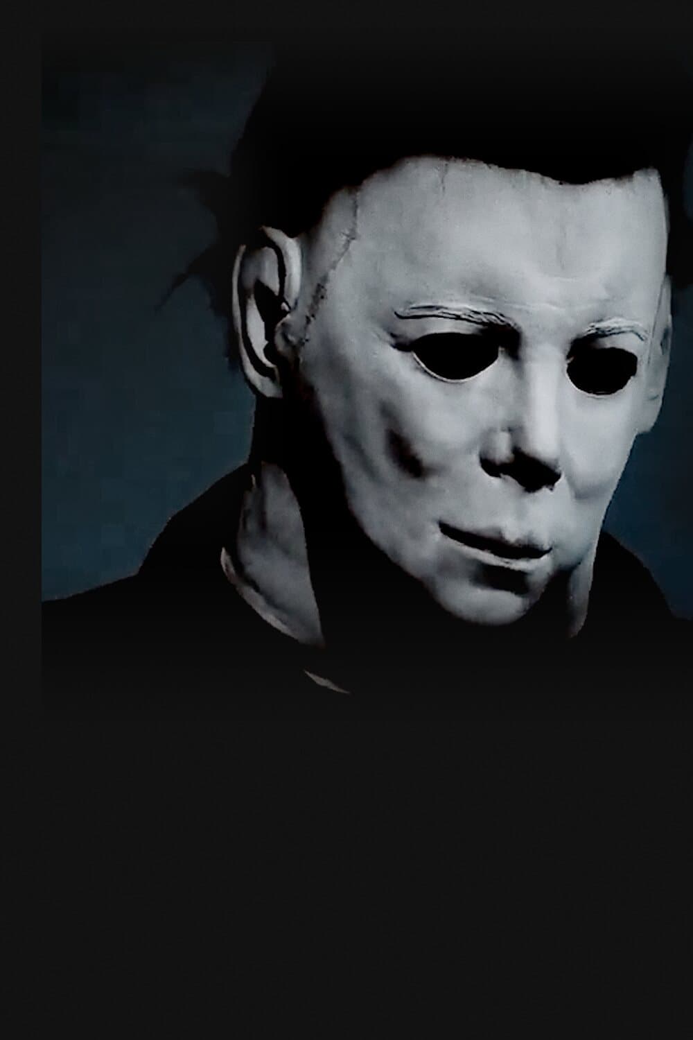 Close-up of a hand-finished Michael Myers latex mask emerging from darkness