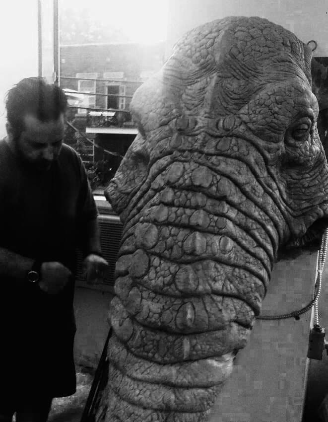 Nikos Dresios working on a large creature sculpture in the studio
